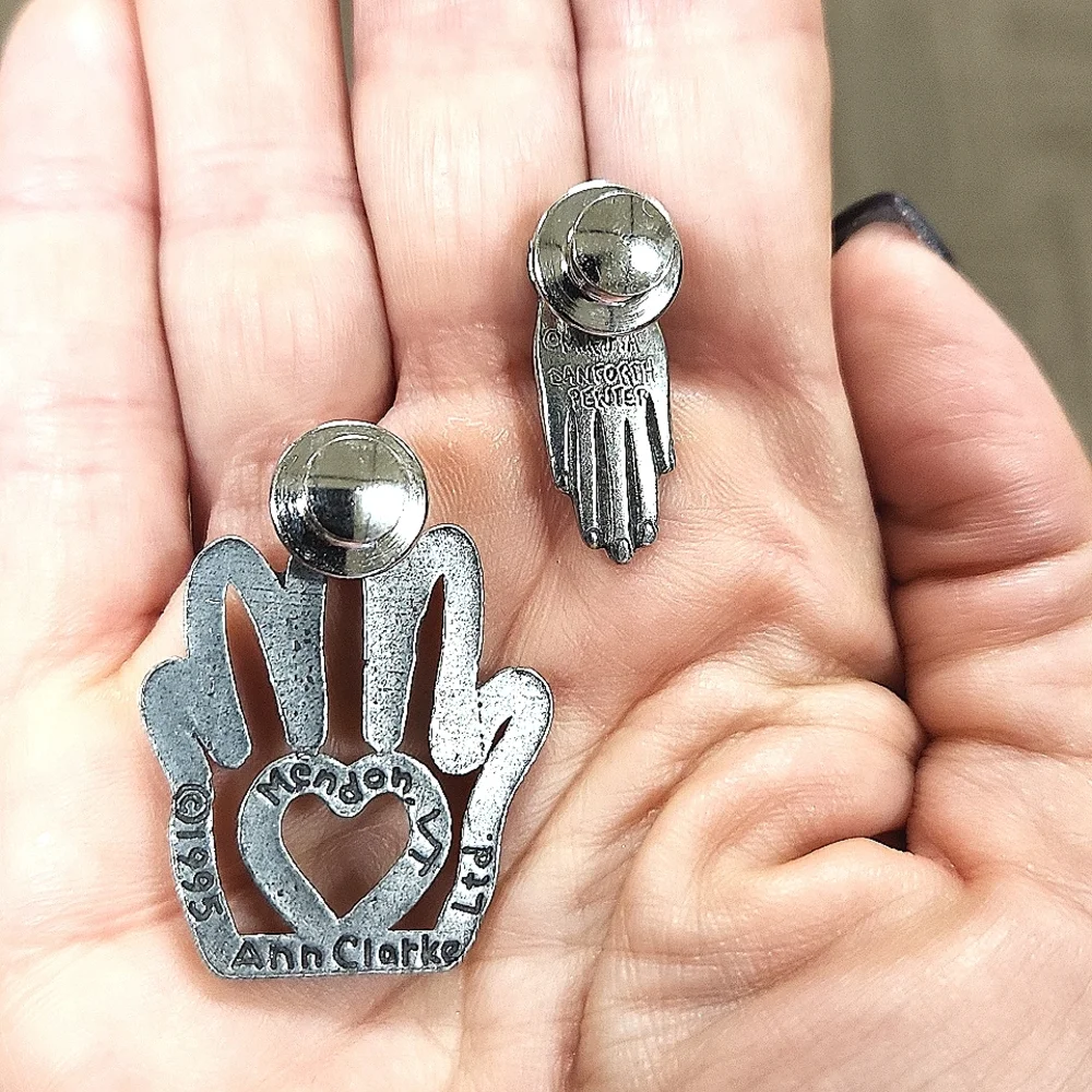 Pair Of Pewter Heart In Hand Clutch Pins